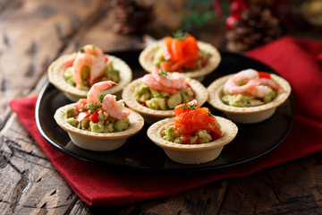 Shrimp and salmon appetizers with avocado cream