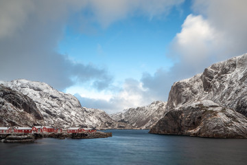 Beautiful traditional fishing red rorbuer huts in Nusfjord village, Lofoten Islands, Norway, Scandinavia