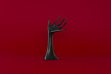 abstract black hand on red background