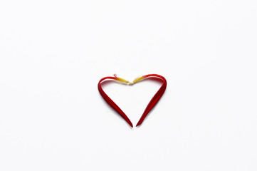 .Heart made of rose petals isolated on white background. Romance, copy space