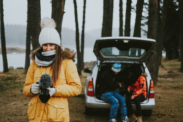 Young woman photographer in forest