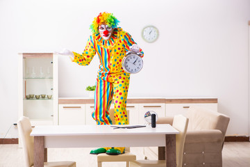 Male clown preparing for perfomance at home 