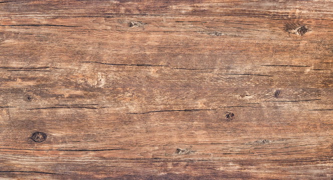 Wood texture background., rough rustic wooden table with cracks and knots. Brown vintage wood for backdrop. Surface of old plank with nature color and pattern.