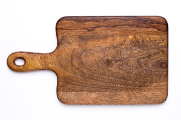 Wooden kitchen board on a white background top view