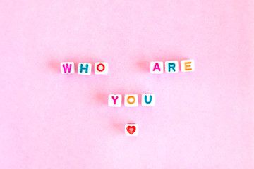 Phrase"Who are you" made out of beads