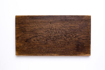 Wooden kitchen board on a white background top view
