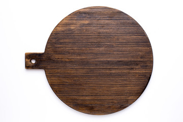 Wooden circle kitchen board on a white background top view