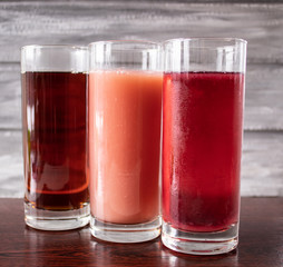 Juice in a glass on a dark table.