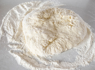 Knead dough on a white background. Hand kneaded dough.