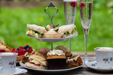 Afternoon tea with sandwiches and cakes