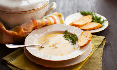 Creamy fish soup with salmon, potatoes and dill