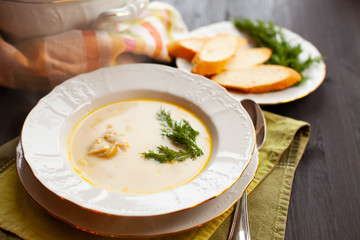Creamy fish soup with salmon, potatoes and dill