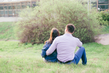 Lovers hug each other and look into the distance