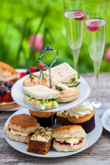 Afternoon tea with sandwiches and cakes