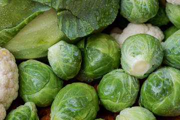 A variety of fresh raw Organic Vegetables including Brussels sprouts, Cauliflowers, Cabbage.