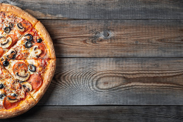 Tasty pepperoni pizza with mushrooms and olives.