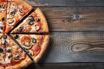 Tasty pepperoni pizza with mushrooms and olives.