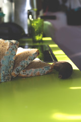 Moldy bread and spoiled potato on green kitchen counter.