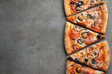 Slices of pepperoni pizza with mushrooms and olives.