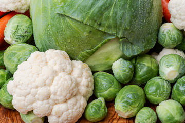 A variety of fresh raw Organic Vegetables including Carrots, Cabbage, Cauliflowers, Brussels sprouts.