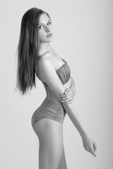 Fototapeta premium Slim body of young woman in bikini on white . Girl with healthy sporty figure