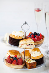 Afternoon tea with sandwiches and cakes