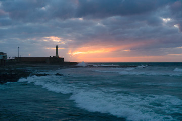 Fototapeta na wymiar Sunset time View on the Atlantic Ocean and Lighthouse in Rabat, The capital of Morocco