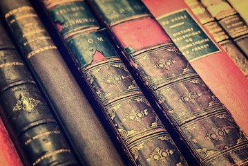 Close up of antique leather books, vintage style background