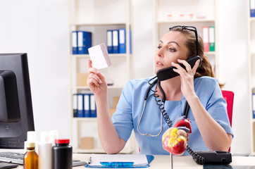 Female doctor cardiologist working in the clinic 