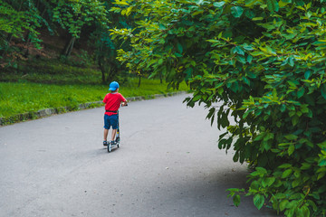 little kid ride on scooter by city park