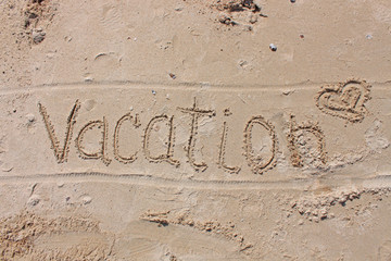 The inscription on the beach sand - Vacation