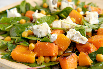 Healthy salad with spinach and pumpkin