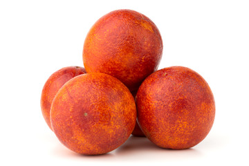 Bloody orange on a white background. Several red orange close-up on a white background.