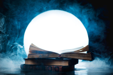 An open book of spells in full Moon. Reader imagination and writing inspiration concept with copy...