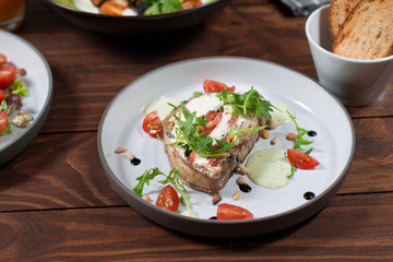 Appetizer of eggplant, Kalamata olives, green onions and cottage cheese. Mediterranean snack. Vegan health food