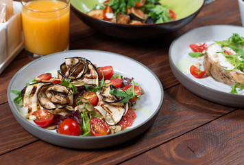 Grilled eggplant salad, tomatoes, lettuce with olive oil and red balsamic, sea salt and pink pepper. Vegan health food
