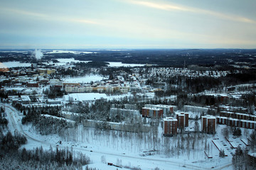 Amazing panoramic landscape of winter pine forest from top of Puijo Tower, Kuopio, Finland