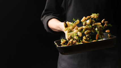 Professional chef prepares seafood with greens. octopus kalmar mussels. Sea food. Asian and Eastern cuisine. culinary background. Food freeze. Menu © Anton