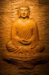 Buddha carving on stone.