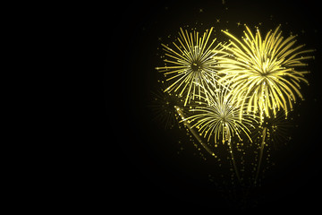 Beautiful festive gold fireworks on black background