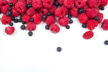 Various fresh summer berries on a white background. Top view