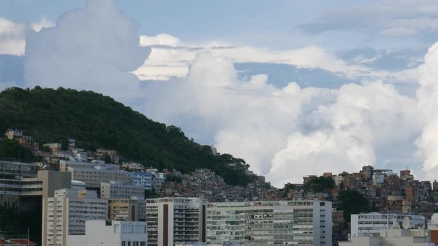 Timelapse of dramatic cumulus clouds above Cantagalo / Pavao Pavaozinho favela near Ipanema, Rio de Janeiro, Brazil