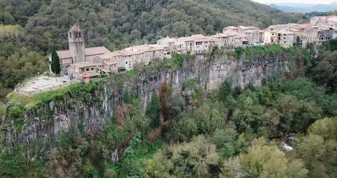 Aerial view of Castellfollit de la Roca, medieval Catalan hamlet on cliff on autumn day