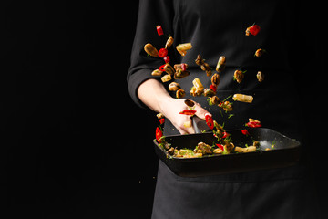 Professional chef prepares seafood with spicy chili peppers and greens. octopus kalmar mussels. Sea food. Asian and Oriental cuisine, Mexican spicy. Culinary background. Freezing food close up © Anton