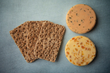 Cheese and crackers on a blue background 