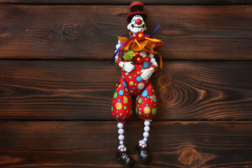 Clown on wooden background