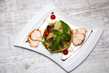 salad with meat, vegetables, cheese and basil