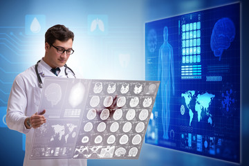 Doctor in telemedicine concept looking at x-ray image