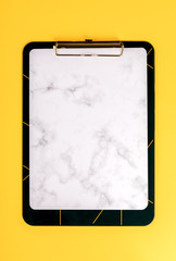 Сlipboard,Notebook on a bright yellow background.Accessories office concept.Top View.Flat Lay. Copy space for Text.