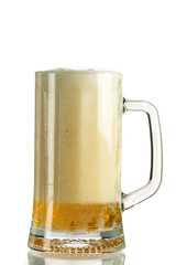 Pouring light beer in a beer mug, it turns out foam and spray